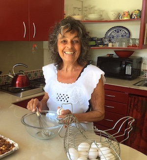 Karina cooking in the kitchen in Sayulita